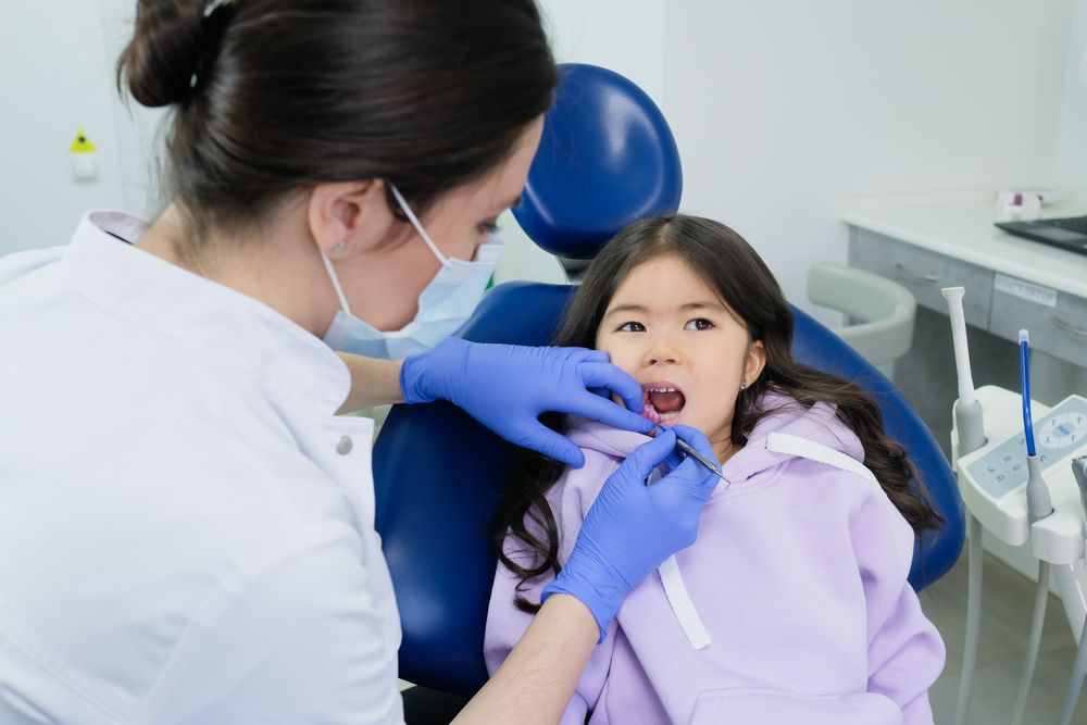 A young patient having a friendly check-up at the clinic